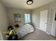 Bright bedroom with carpet and two windows for plenty of natural light at 1237 Tamarac St, Denver, CO 80220