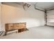Spacious garage with an access door to attic, providing additional storage at 1237 Tamarac St, Denver, CO 80220
