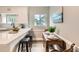 Well-lit kitchen with modern fixtures, sleek countertops, and an eat-in area, creating a functional and welcoming space at 1237 Tamarac St, Denver, CO 80220