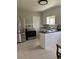 Well-lit kitchen features stainless steel appliances and white cabinets at 1237 Tamarac St, Denver, CO 80220