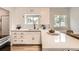 Stylish kitchen featuring white cabinetry, modern appliances, and a functional layout for cooking and entertaining at 1237 Tamarac St, Denver, CO 80220