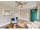 Bright living room with a striking green front door, hardwood floors, and stylish decor for a comfortable living space at 1237 Tamarac St, Denver, CO 80220