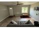 Comfortable living room with tile floors, neutral colors, and lots of light at 1237 Tamarac St, Denver, CO 80220