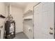 This utility room contains a water heater and built-in shelves at 1237 Tamarac St, Denver, CO 80220
