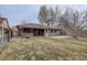 Private backyard featuring a hot tub area and a well-manicured lawn at 2285 Ironton St, Aurora, CO 80010
