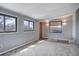 Finished basement featuring neutral paint and carpet with two windows and recessed lighting at 2285 Ironton St, Aurora, CO 80010