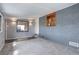 Finished basement featuring neutral paint and carpet with one window, bar and recessed lighting at 2285 Ironton St, Aurora, CO 80010
