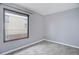 Bedroom featuring neutral paint and new carpet at 2285 Ironton St, Aurora, CO 80010