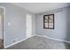 Bedroom featuring neutral paint, a window and new carpet at 2285 Ironton St, Aurora, CO 80010