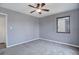 Bedroom featuring neutral paint, carpet, one window, and a ceiling fan at 2285 Ironton St, Aurora, CO 80010