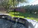 Relax in this backyard hot tub with a landscaped yard and mature trees at 2285 Ironton St, Aurora, CO 80010