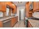 Updated kitchen with stainless steel appliances and granite countertops at 2285 Ironton St, Aurora, CO 80010
