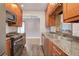 Updated kitchen with stainless steel appliances and granite countertops at 2285 Ironton St, Aurora, CO 80010