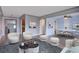 Bright and airy living room with modern decor, hardwood floors, and an open floor plan at 2285 Ironton St, Aurora, CO 80010