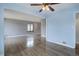 Open living room featuring wood floors, fresh paint, and bright sunlight at 2285 Ironton St, Aurora, CO 80010