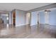 Spacious living room with hardwood floors and an open layout to dining area and kitchen at 2285 Ironton St, Aurora, CO 80010