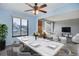 Virtually staged living room and dining room featuring wood floors and modern furniture at 2285 Ironton St, Aurora, CO 80010