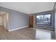 Bright living room with hardwood floors, large window, and an open layout at 2285 Ironton St, Aurora, CO 80010