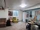 Finished basement features carpeting, guitars, drums, shelving and a window at 10806 W Evans Ave # 5, Lakewood, CO 80227