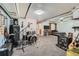 Finished basement offers a versatile space, ideal for a music room, with a drum set and other instruments at 10806 W Evans Ave # 5, Lakewood, CO 80227