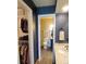 Hallway view of a bathroom and walk in closet at 10806 W Evans Ave # 5, Lakewood, CO 80227