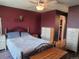 Cozy bedroom featuring a ceiling fan, dresser, and a comfortable bed at 10806 W Evans Ave # 5, Lakewood, CO 80227