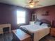 Cozy bedroom featuring a ceiling fan, window, dresser, and a comfortable bed at 10806 W Evans Ave # 5, Lakewood, CO 80227