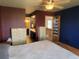 Cozy bedroom featuring a ceiling fan, dresser, and a comfortable bed at 10806 W Evans Ave # 5, Lakewood, CO 80227