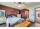 Comfortable bedroom with a ceiling fan and closet entryway at 10806 W Evans Ave # 5, Lakewood, CO 80227