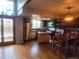 A kitchen with wooden floors, stainless appliances, an island, and an adjacent dining area at 10806 W Evans Ave # 5, Lakewood, CO 80227