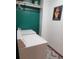 Functional laundry room with a modern washer and dryer, complemented by storage shelves and stylish decor at 10806 W Evans Ave # 5, Lakewood, CO 80227