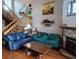 Inviting living room with hardwood floors, a cozy fireplace, and comfortable seating at 10806 W Evans Ave # 5, Lakewood, CO 80227