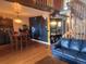 Spacious living area with high ceilings, hardwood floors, stylish decor, and a staircase leading to upper level at 10806 W Evans Ave # 5, Lakewood, CO 80227