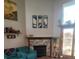 Bright living room featuring a stone fireplace, large windows, and stylish decor at 10806 W Evans Ave # 5, Lakewood, CO 80227