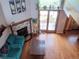 Top-down view of the living room showcasing the stone fireplace and outdoor access at 10806 W Evans Ave # 5, Lakewood, CO 80227