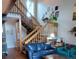 Bright living room featuring staircase, decor, and comfortable seating at 10806 W Evans Ave # 5, Lakewood, CO 80227