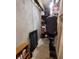 Unfinished storage space with utilitarian shelving and clothes rack providing space for organization at 10806 W Evans Ave # 5, Lakewood, CO 80227