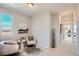 Cozy sitting area filled with bright, natural light featuring plush chairs and modern decor at 95 N Vandriver Pl, Aurora, CO 80018
