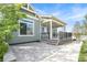 Charming backyard patio and covered porch area featuring an outdoor living space at 4873 Cathay Ct, Denver, CO 80249