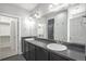 Bathroom features double vanity sinks and ample counter space with walk-in closet at 4873 Cathay Ct, Denver, CO 80249