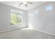 Bright, carpeted room with large windows allowing for plenty of natural light at 4873 Cathay Ct, Denver, CO 80249