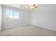 Bedroom featuring plush carpet, a window and a ceiling fan at 4873 Cathay Ct, Denver, CO 80249