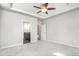 Spacious bedroom with plush carpet, ceiling fan and ensuite bathroom at 4873 Cathay Ct, Denver, CO 80249