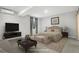 This virtually staged bedroom showcases a cozy bed with accent pillows, a plush rug, and ample natural light from the window at 4873 Cathay Ct, Denver, CO 80249