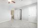 Neutral bedroom featuring plush carpeting, multiple doors, and soft natural light at 4873 Cathay Ct, Denver, CO 80249