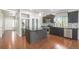 Modern kitchen features stainless steel appliances, dark cabinetry, and a kitchen island at 4873 Cathay Ct, Denver, CO 80249