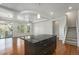Open-concept living area features hardwood floors, recessed lighting, and stairs to the upper level at 4873 Cathay Ct, Denver, CO 80249