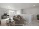 Living room with neutral colors, modern furniture, plush carpet and natural light at 4873 Cathay Ct, Denver, CO 80249