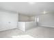 Carpeted loft featuring a half wall and multiple white closets at 4873 Cathay Ct, Denver, CO 80249