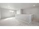 Bright loft space featuring neutral decor, soft carpeting, and a large window allowing for ample natural light at 4873 Cathay Ct, Denver, CO 80249